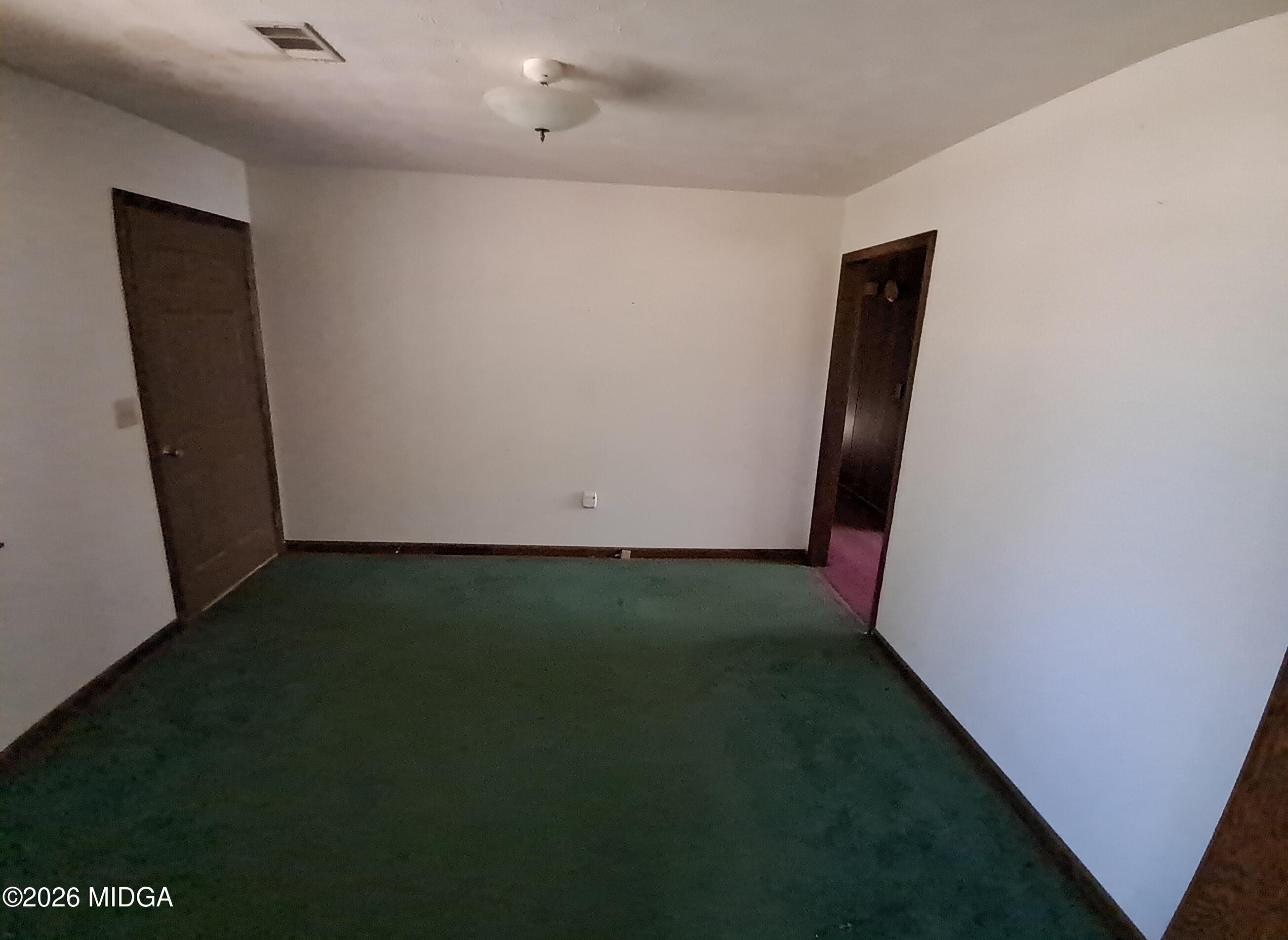 110 Irwinton Road Toomsboro, GA 31090 - Photo 5 of 17 a view of an empty room