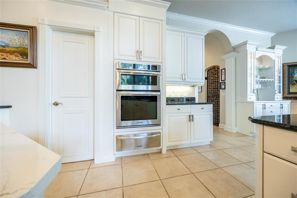 11616 Southwest 6th Lane Gainesville, FL 32607 - Photo 27 of 67 a kitchen with stainless steel appliances a stove a sink and a refrigerator