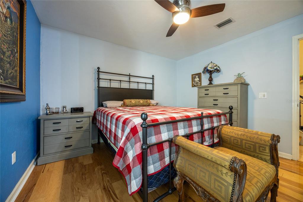 11616 Southwest 6th Lane Gainesville, FL 32607 - Photo 31 of 67 a bedroom with a bed and a chandelier