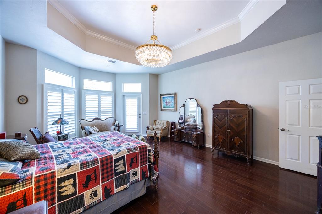 11616 Southwest 6th Lane Gainesville, FL 32607 - Photo 55 of 67 a bedroom with bed and wooden floor