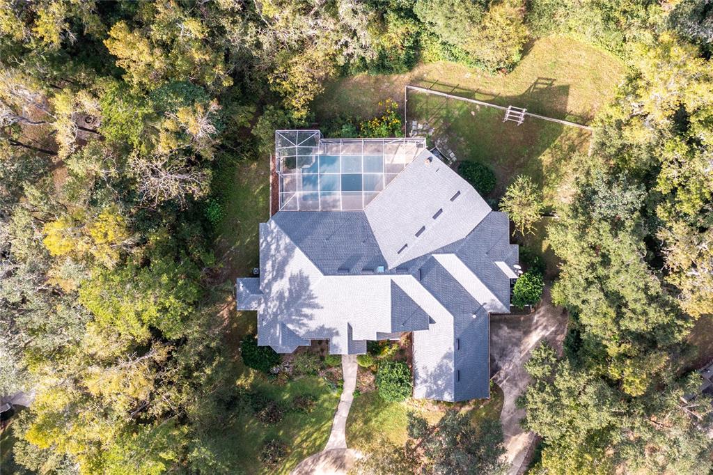 11616 Southwest 6th Lane Gainesville, FL 32607 - Photo 6 of 67 an aerial view of a house with a yard and mountain view in back