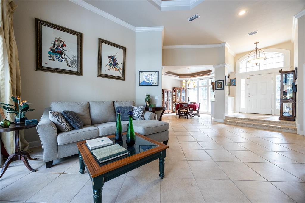 11616 Southwest 6th Lane Gainesville, FL 32607 - Photo 10 of 67 a living room with furniture a dining table and paintings on the wall
