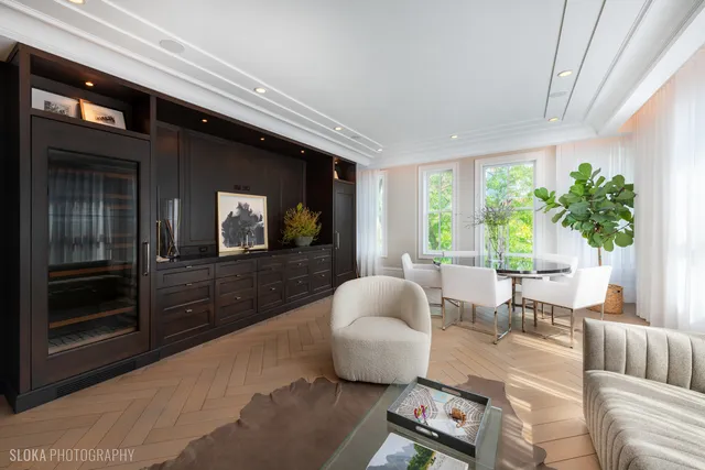 a bathroom with a granite countertop sink a mirror and a shower
