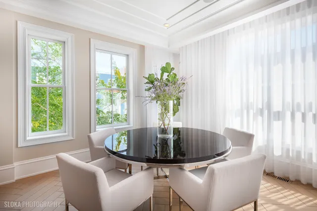 a spacious bathroom with a tub sink and mirror