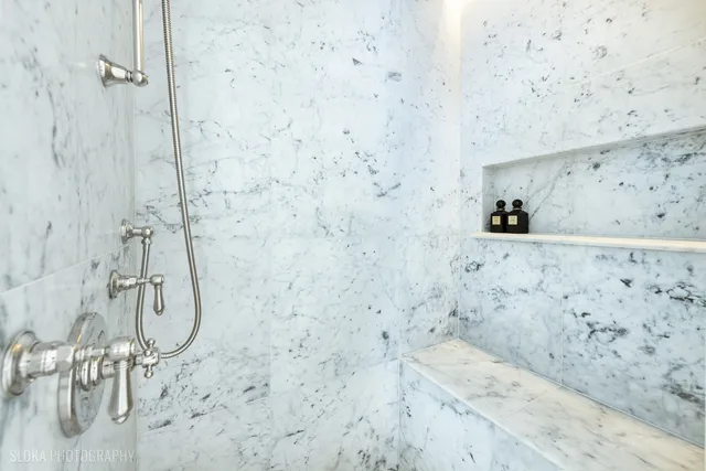 a balcony with furniture and a potted plant