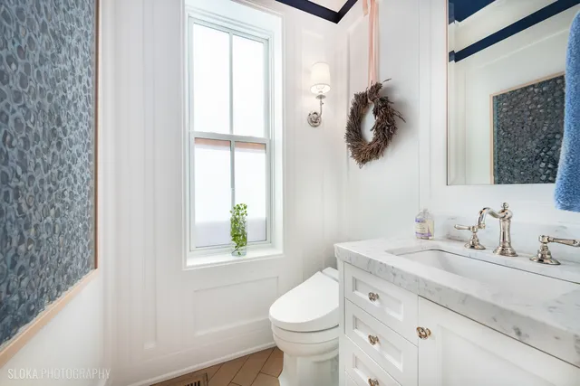 a view of a patio with couches chairs potted plants and city view