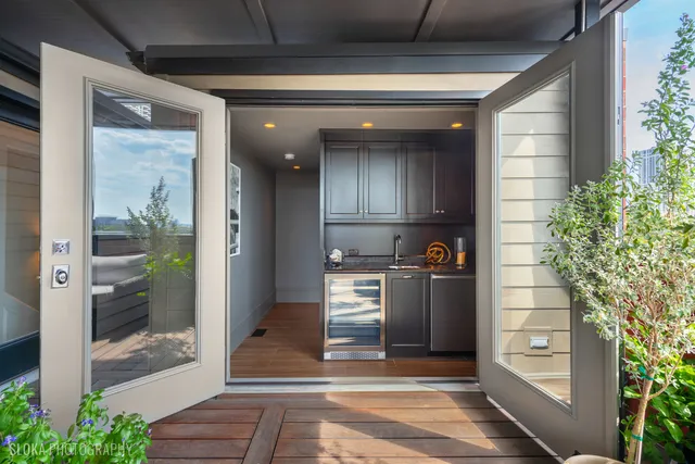 a view of a livingroom with wooden floor and cabinet