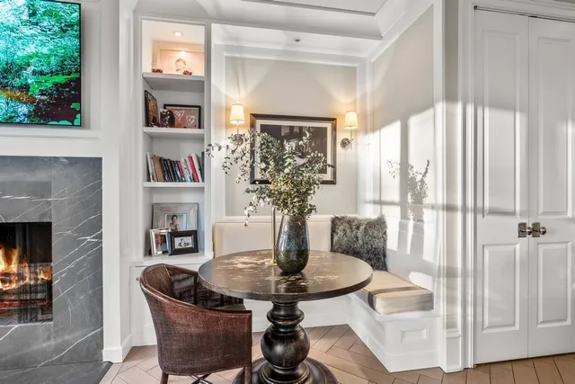 a view of a hallway with staircase and white walls