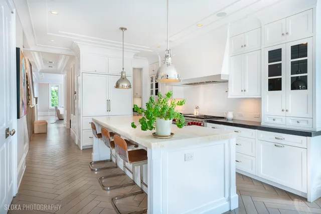 a kitchen with sink stove and cabinets
