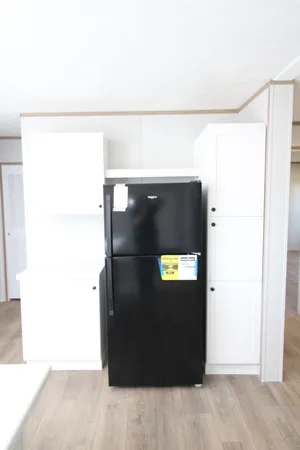 a kitchen with a stove and a refrigerator