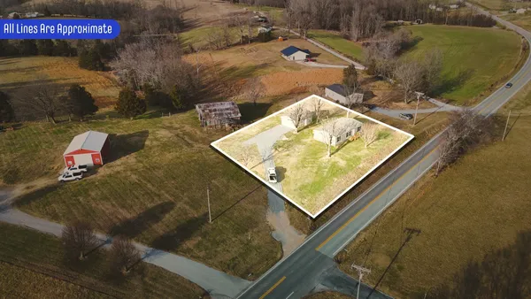 a aerial view of a house with a yard