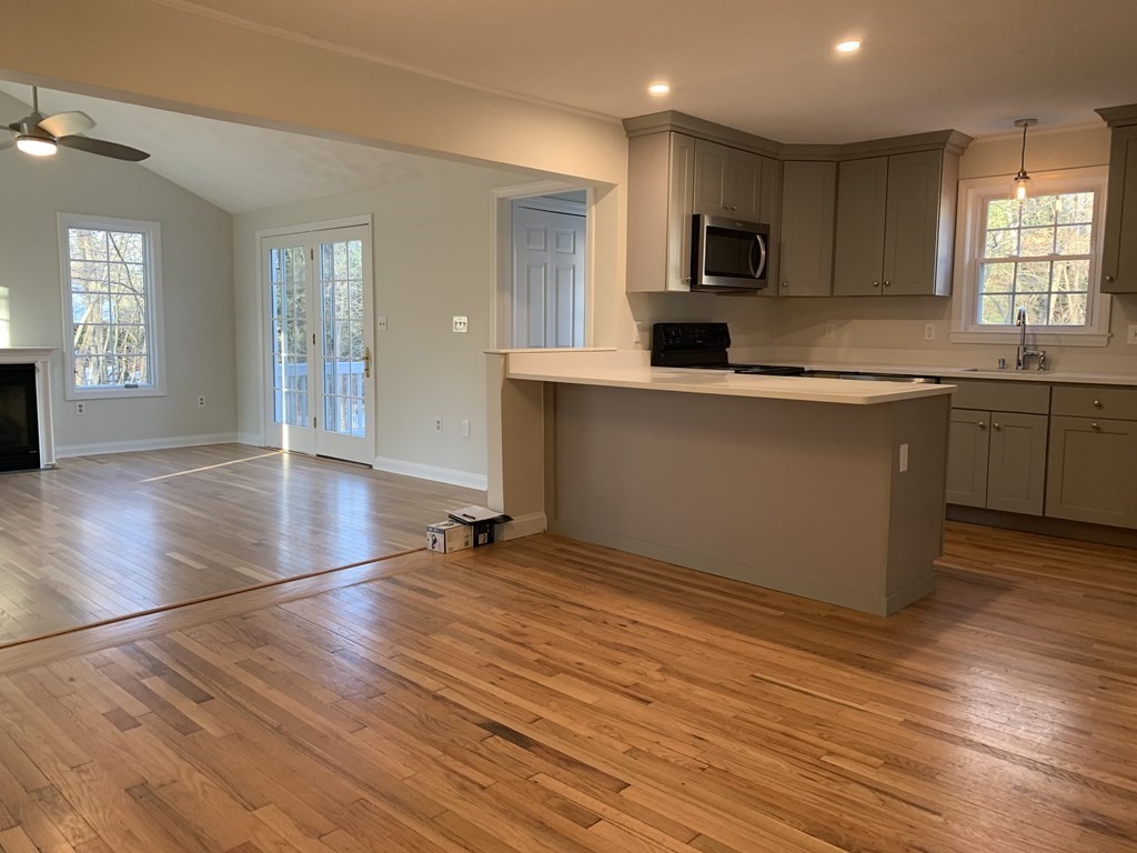 7 Oregon Road Ashland, MA 01721 - Photo 5 of 27 a kitchen with granite countertop a stove and a sink