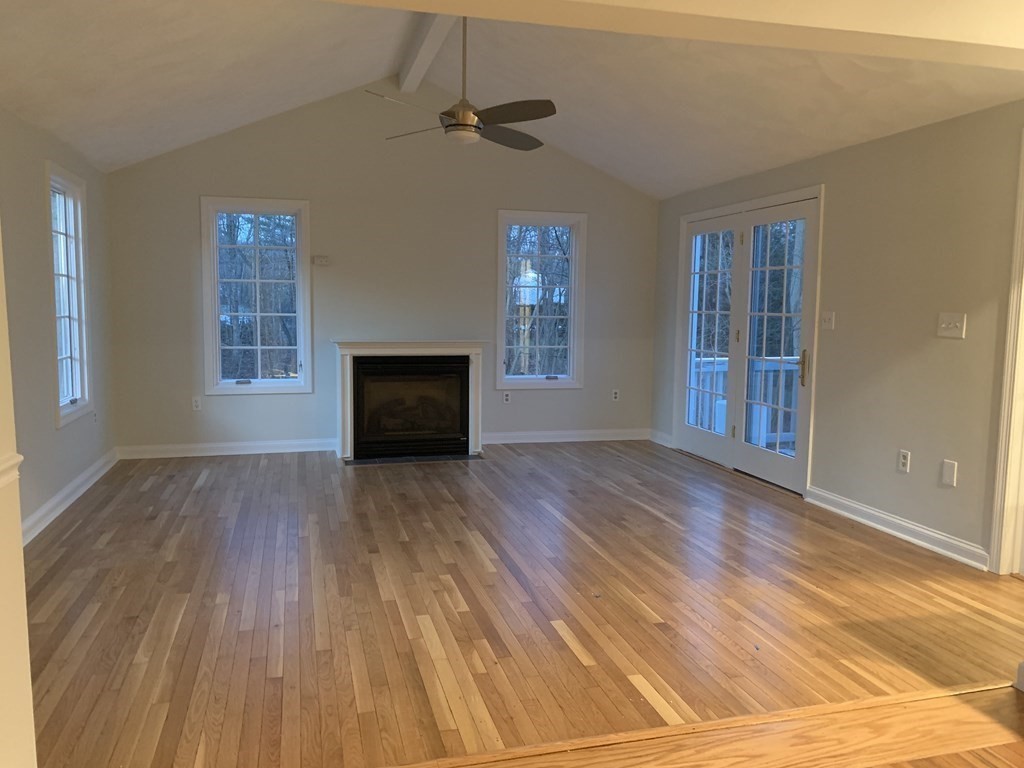 7 Oregon Road Ashland, MA 01721 - Photo 8 of 27 a view of empty room with wooden floor and fan