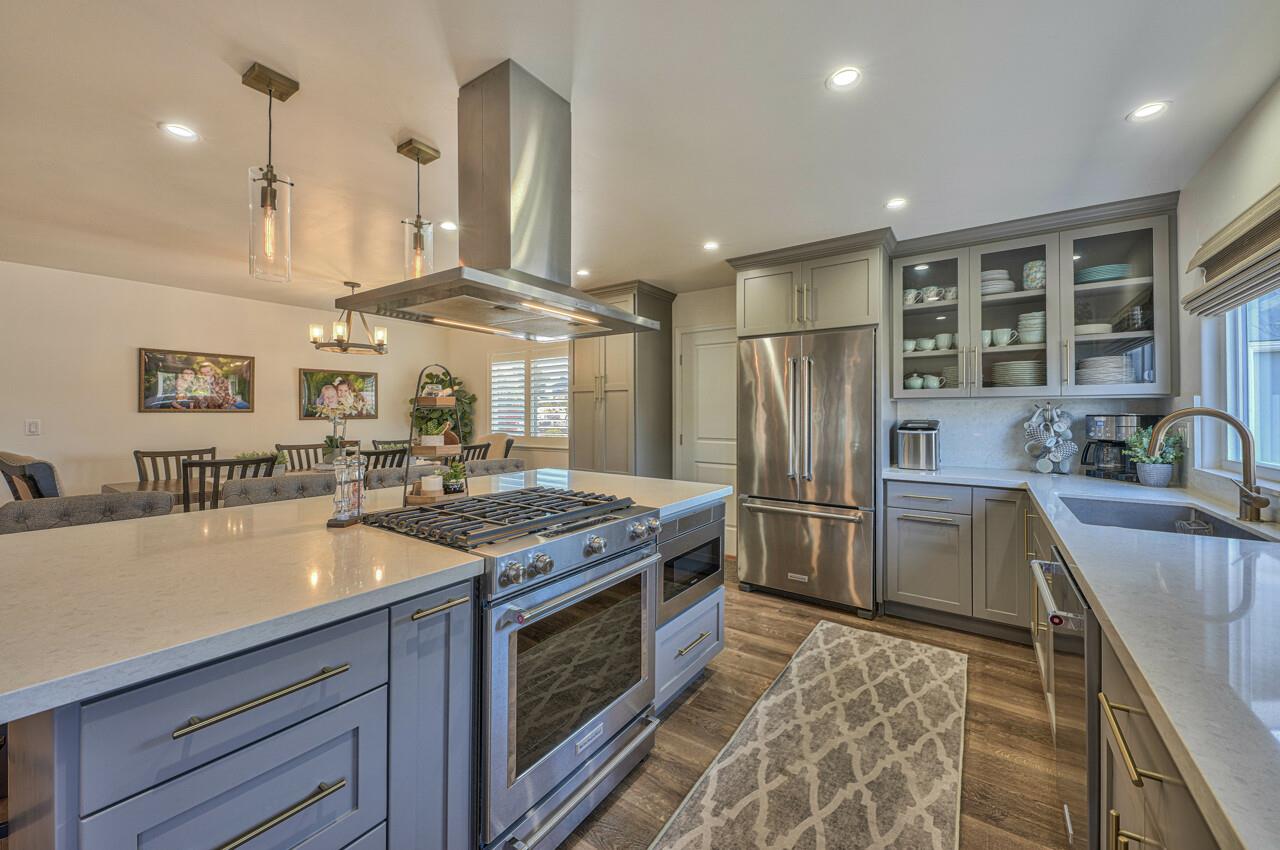 9859 Brookgrass Place Prunedale, CA 93907 - Photo 11 of 39 a kitchen with stainless steel appliances granite countertop a sink stove and refrigerator
