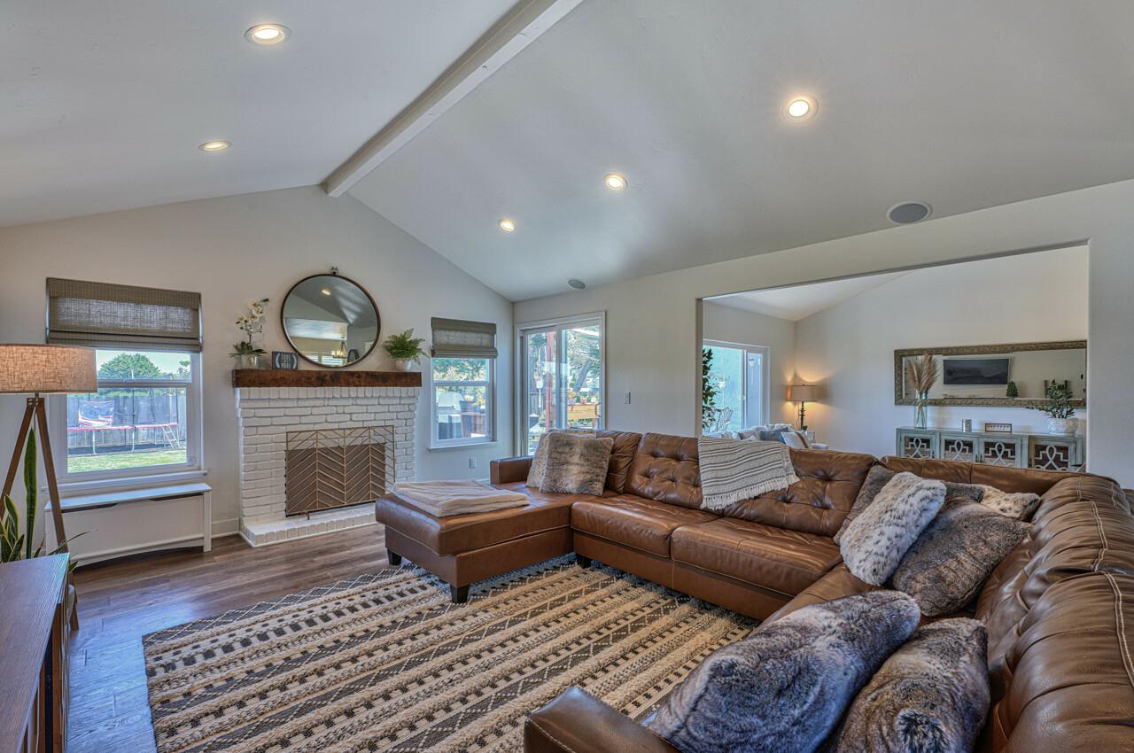 9859 Brookgrass Place Prunedale, CA 93907 - Photo 12 of 39 a living room with furniture and a fireplace