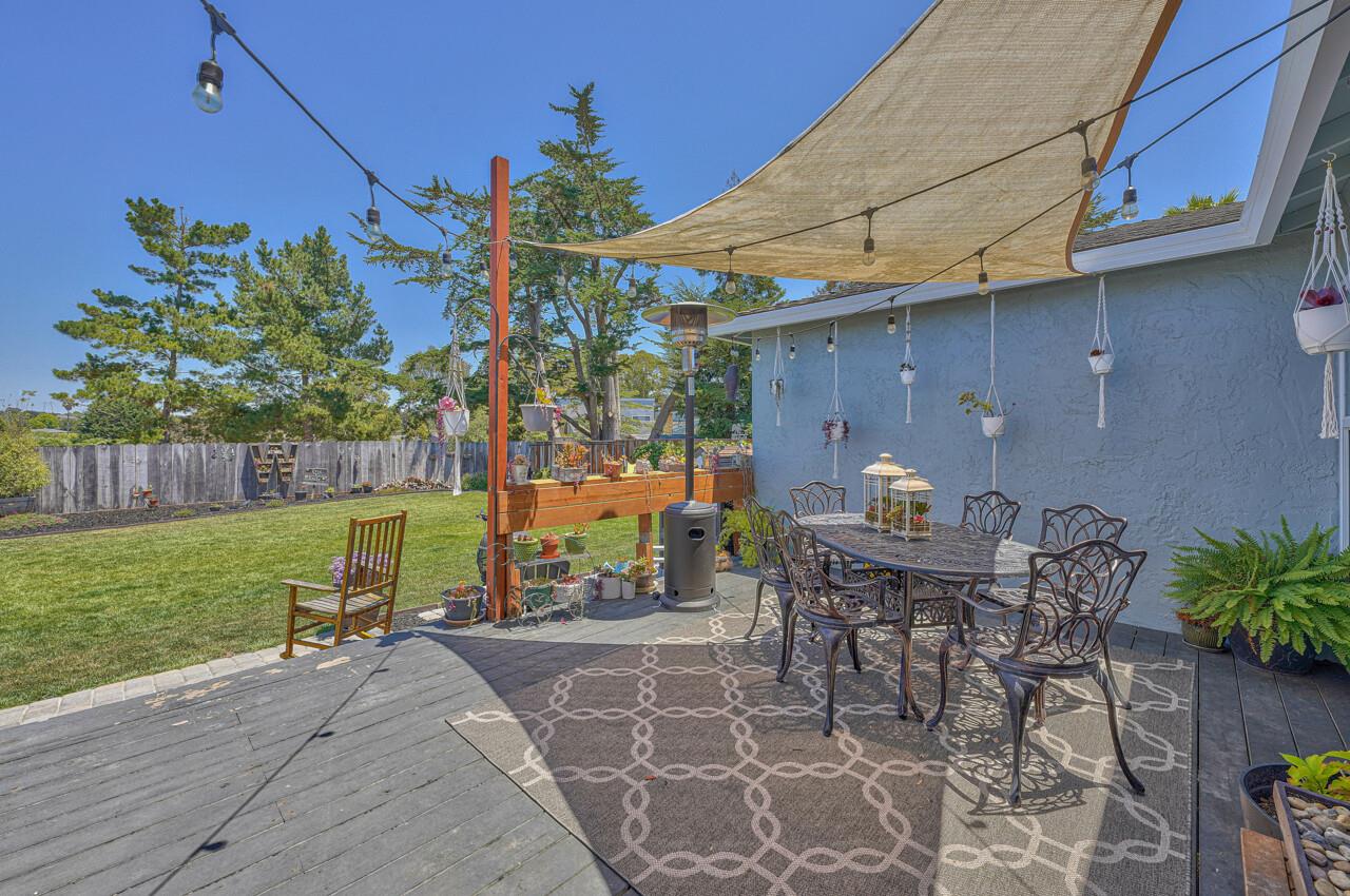 9859 Brookgrass Place Prunedale, CA 93907 - Photo 13 of 39 a view of a patio with table and chairs potted plants