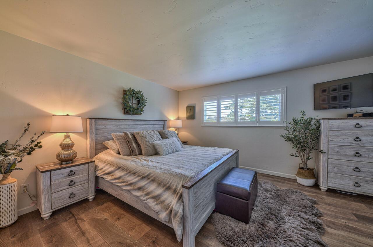 9859 Brookgrass Place Prunedale, CA 93907 - Photo 17 of 39 a bedroom with a bed and a window