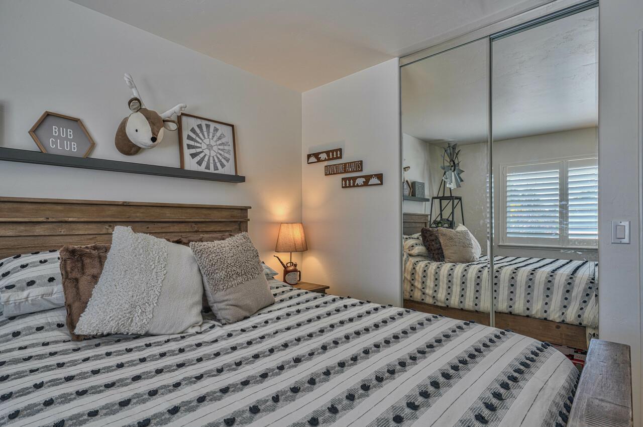 9859 Brookgrass Place Prunedale, CA 93907 - Photo 22 of 39 a bedroom with a bed and painting on the wall