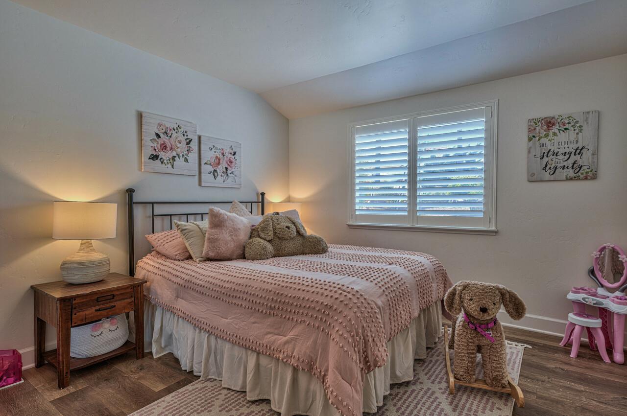 9859 Brookgrass Place Prunedale, CA 93907 - Photo 23 of 39 a bedroom with a bed and a chair