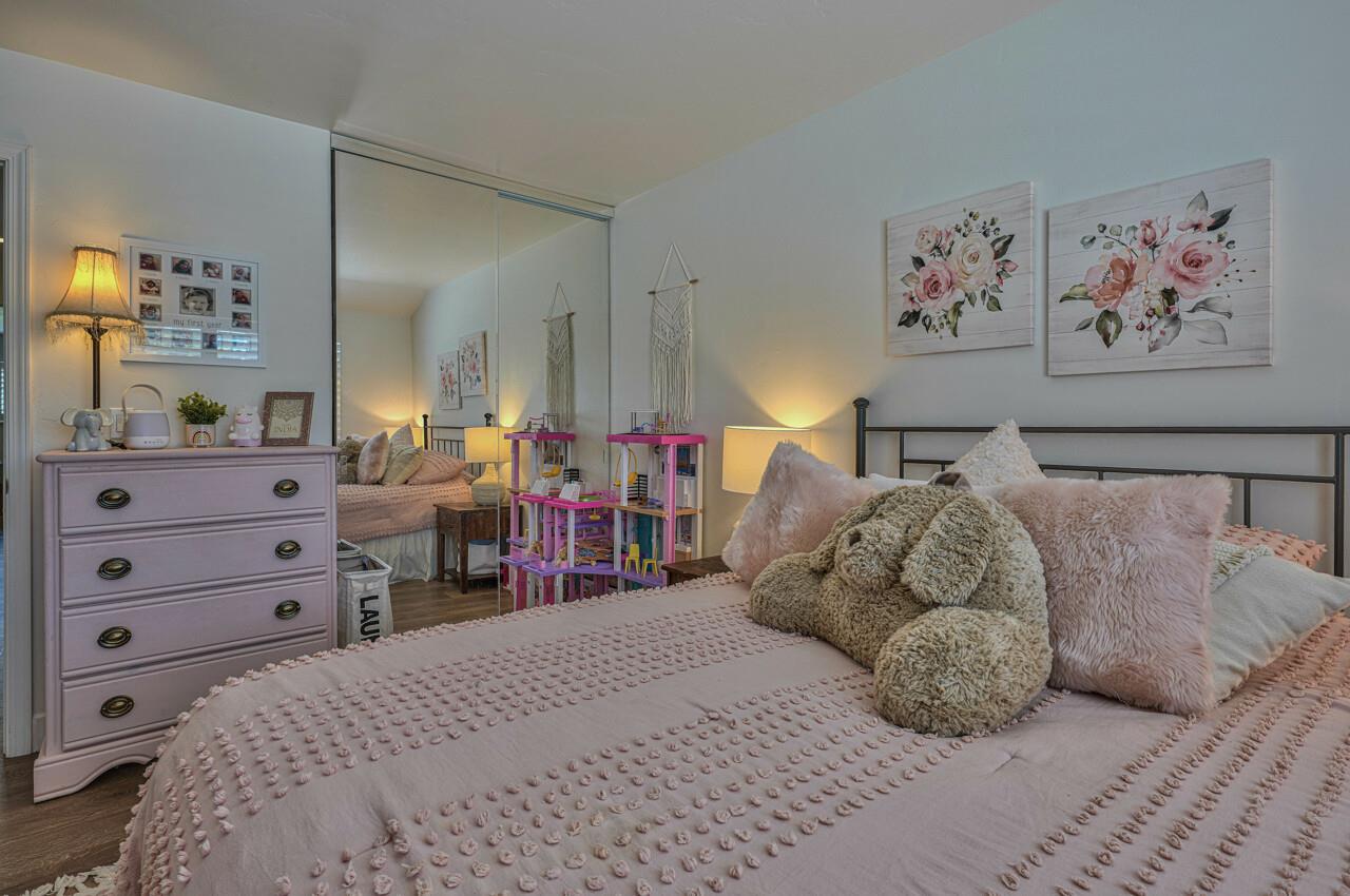 9859 Brookgrass Place Prunedale, CA 93907 - Photo 24 of 39 a bed room with a bed and a tv