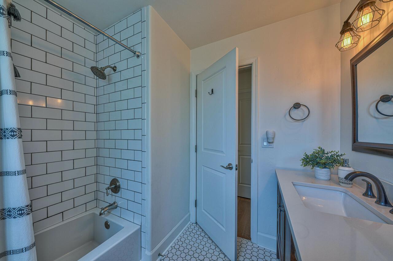 9859 Brookgrass Place Prunedale, CA 93907 - Photo 28 of 39 a bathroom with a tub shower sink and mirror