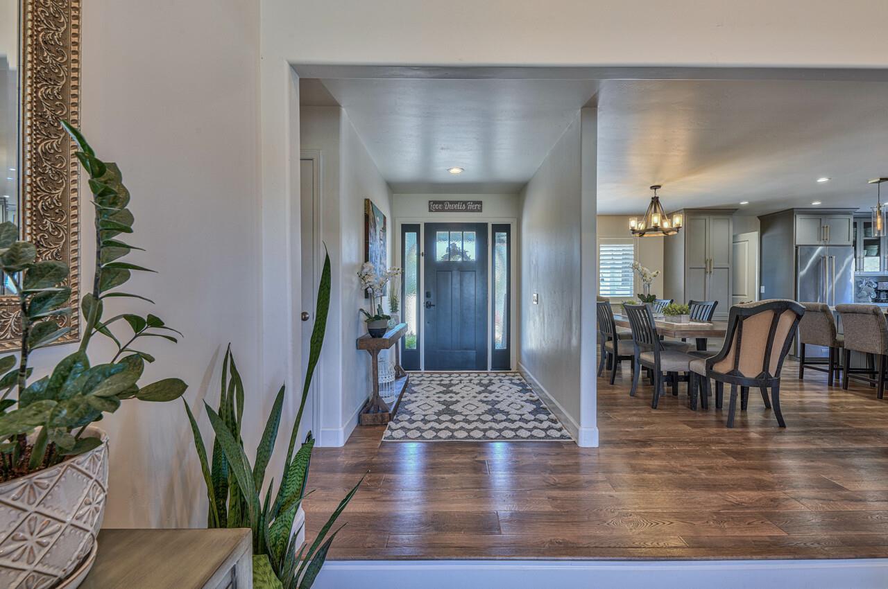 9859 Brookgrass Place Prunedale, CA 93907 - Photo 3 of 39 a view of a dining room with furniture a rug and wooden floor