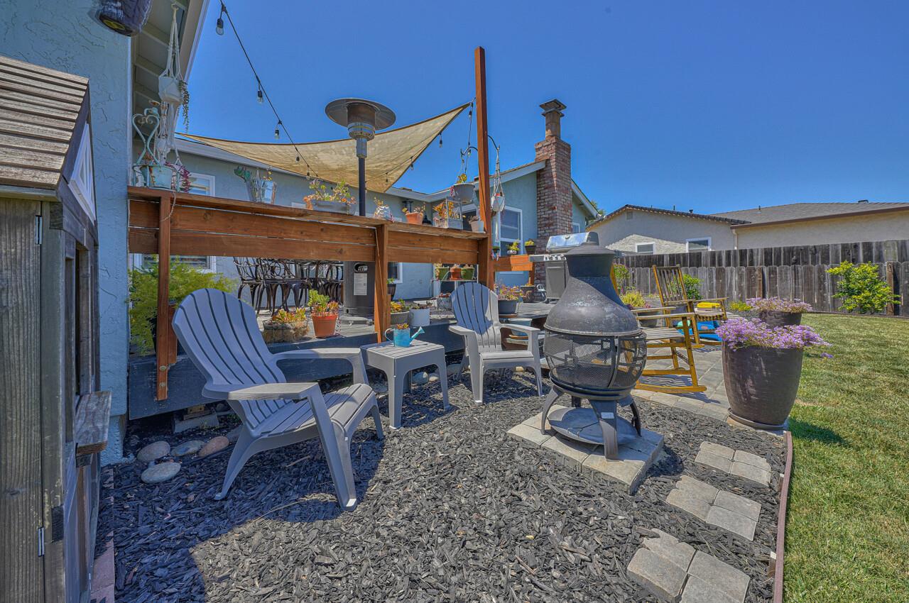 9859 Brookgrass Place Prunedale, CA 93907 - Photo 32 of 39 a view of a patio with a table chairs and a fire pit