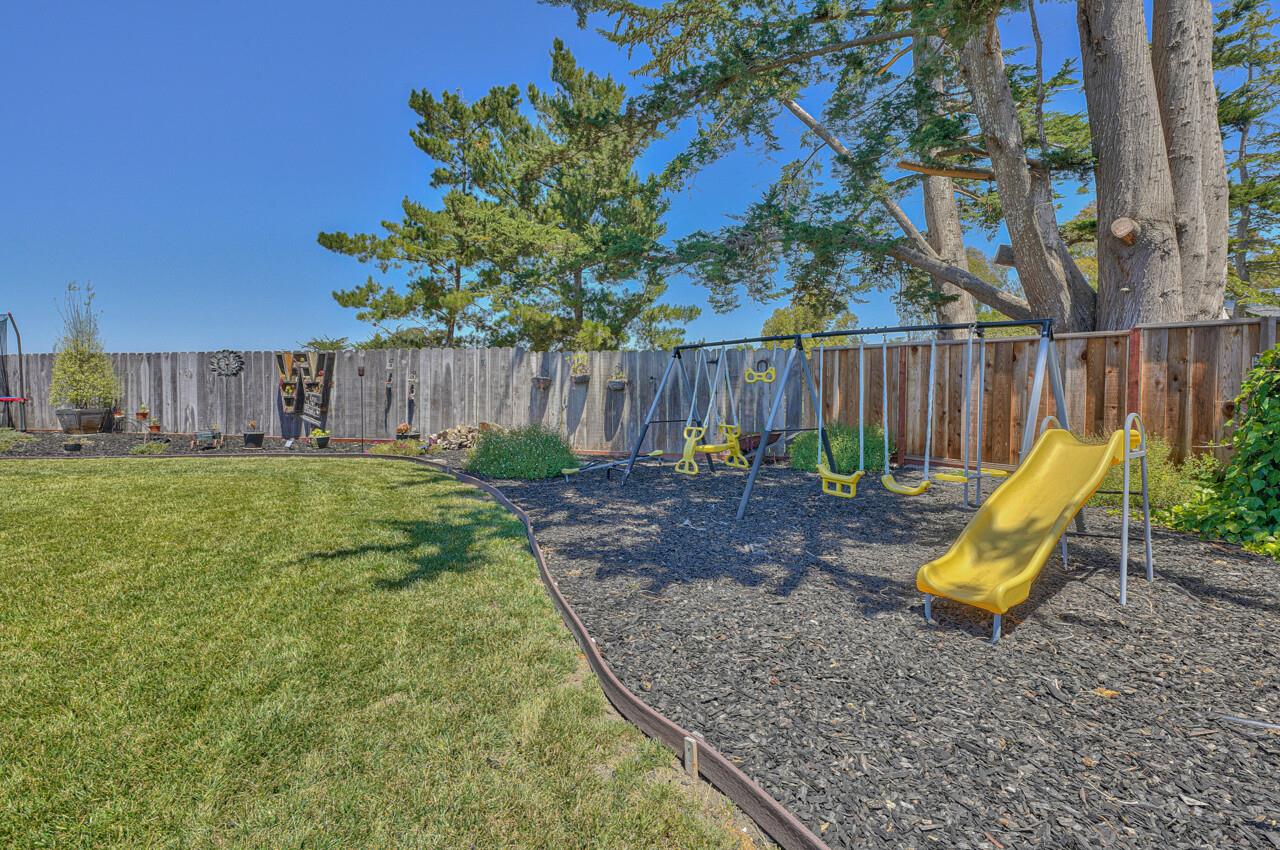 9859 Brookgrass Place Prunedale, CA 93907 - Photo 33 of 39 a view of a backyard with a tree and wooden fence