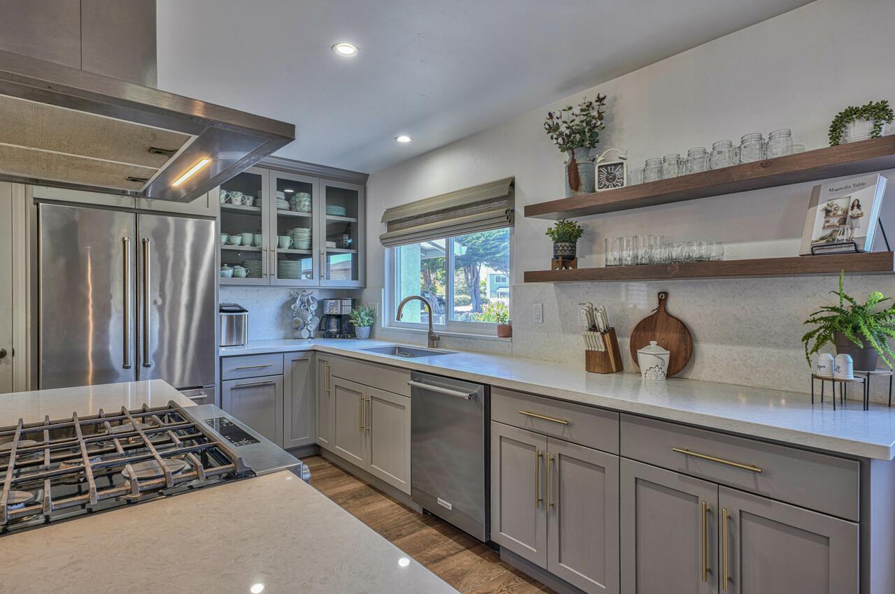 9859 Brookgrass Place Prunedale, CA 93907 - Photo 10 of 39 a kitchen with stainless steel appliances a sink stove and cabinets