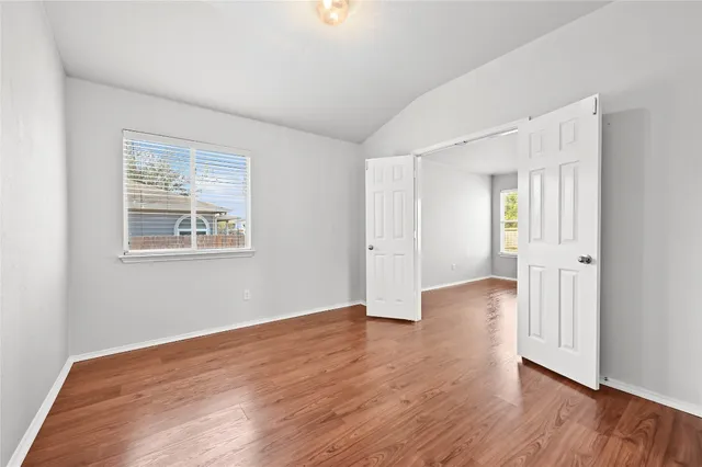a bath room with a sink and a large mirror