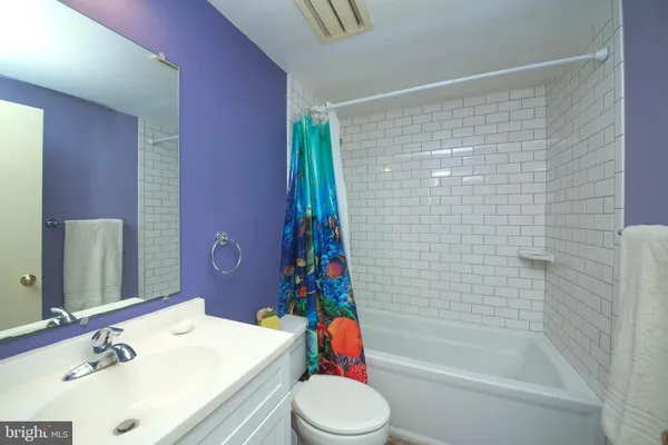 a view of an empty room with large window