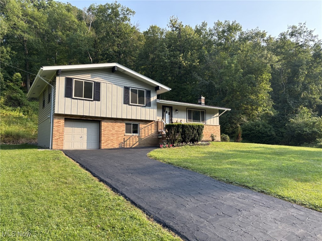 9424 Brookside Road Independence, OH 44131 - Photo 2 of 21 This home has been in the same family since it was built in 1961. The driveway provides plenty of room for parking, when you host a party/gathering.