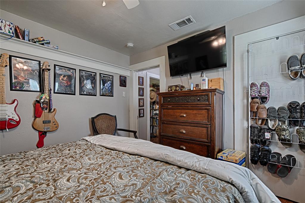 205 West Stark Road Seagoville, TX 75159 - Photo 14 of 39 a bedroom with bed and tv