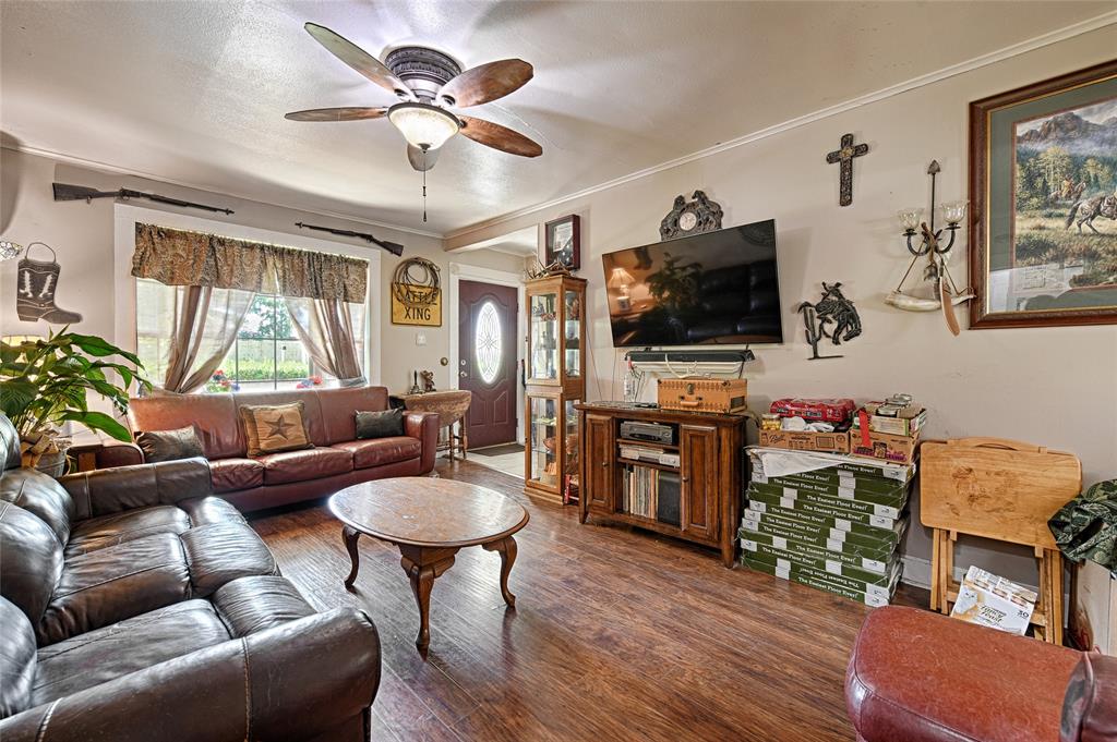 205 West Stark Road Seagoville, TX 75159 - Photo 17 of 39 a living room with furniture and a flat screen tv
