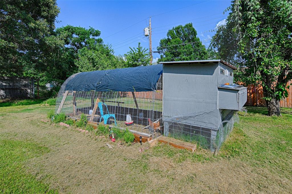 205 West Stark Road Seagoville, TX 75159 - Photo 20 of 39 a view of a chair and table in backyard of the house