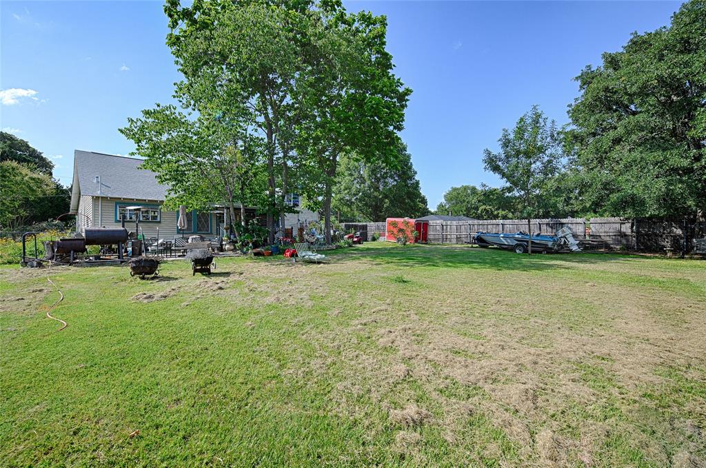 205 West Stark Road Seagoville, TX 75159 - Photo 24 of 39 a view of an house with backyard space and sitting area