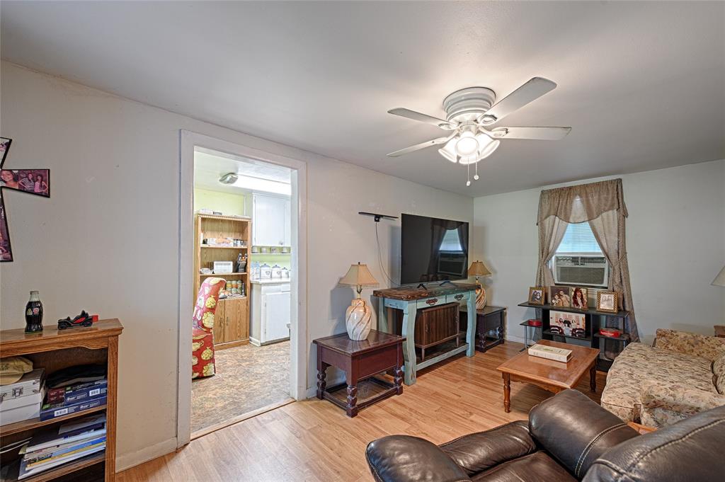 205 West Stark Road Seagoville, TX 75159 - Photo 29 of 39 a living room with furniture and a flat screen tv