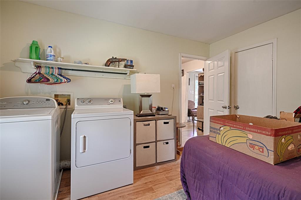 205 West Stark Road Seagoville, TX 75159 - Photo 35 of 39 a bedroom with a bed and a refrigerator