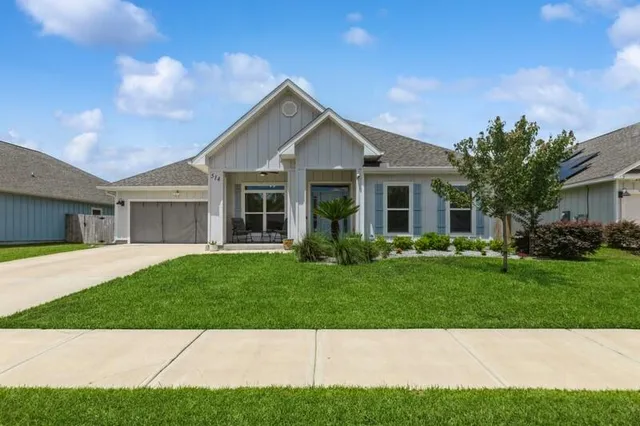 a view of a yard in front of a house
