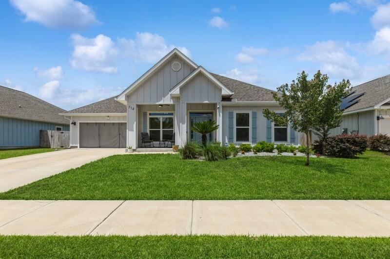 a view of a yard in front of a house