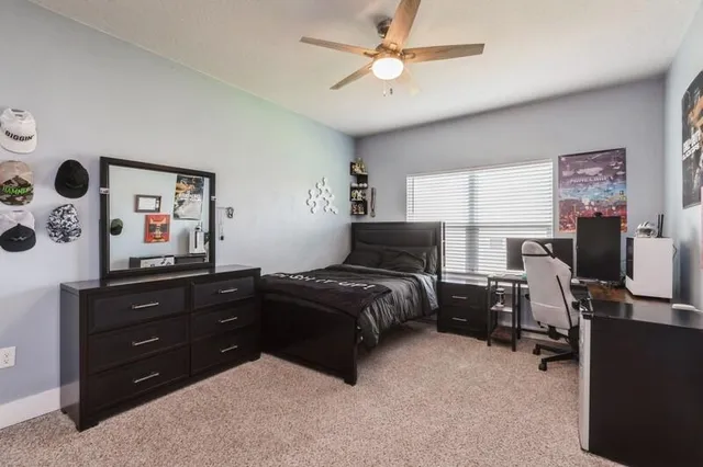 a living room with a dresser and a dresser