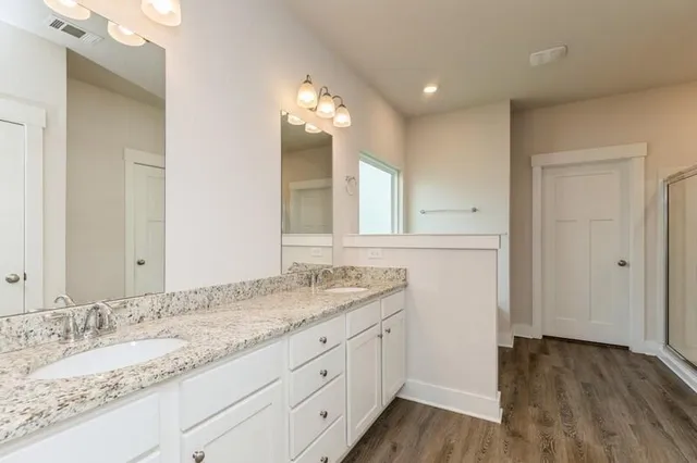 a bathroom with a bathtub and a shower