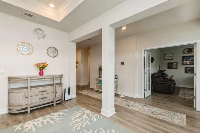 a bed room with a bed and a mirror