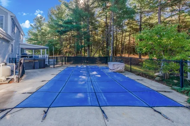 a view of a backyard with sitting area