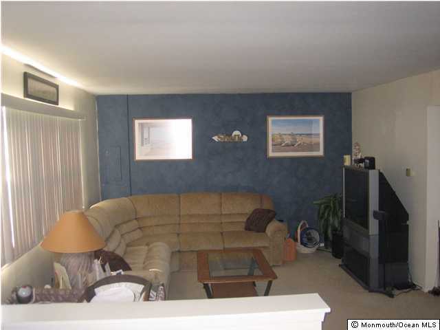 178 Greenwood Loop Road Brick, NJ 08724 - Photo 3 of 3 a living room with furniture a flat screen tv and a window