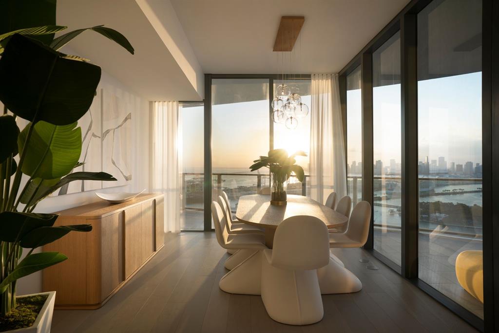 500 Alton Road, Unit 3903 04 Miami Beach, FL 33139 - Photo 15 of 72 a living room with furniture and a floor to ceiling window