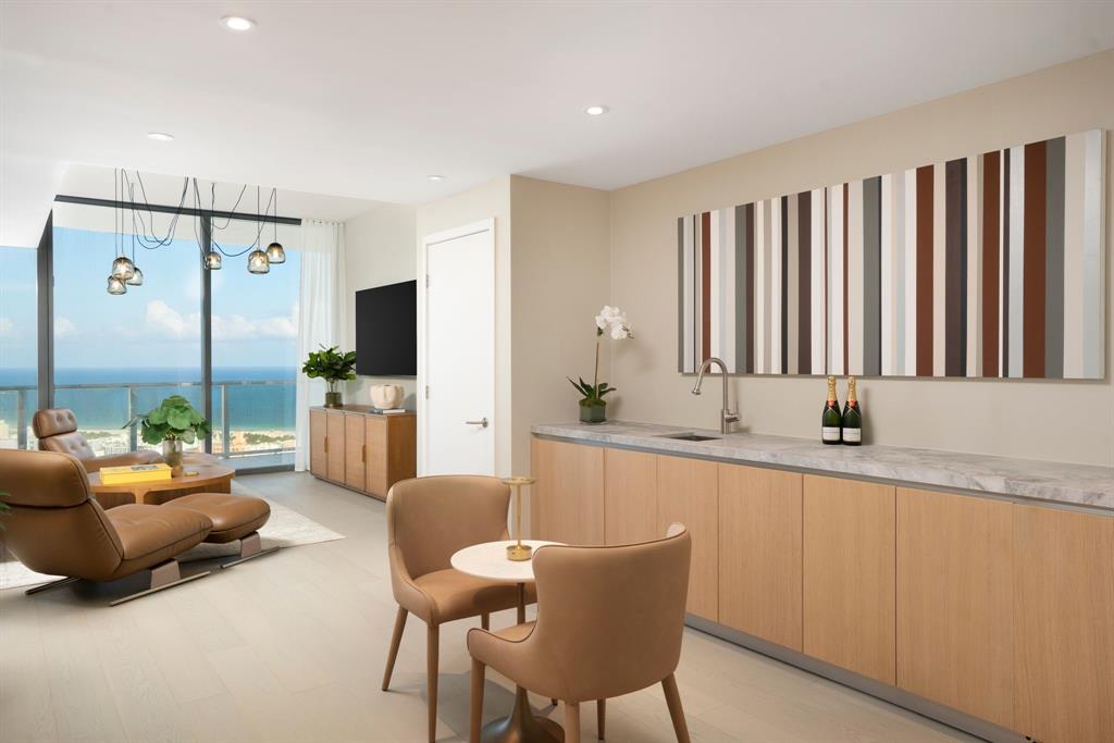 500 Alton Road, Unit 3903 04 Miami Beach, FL 33139 - Photo 20 of 72 a large living room with stainless steel appliances kitchen island granite countertop furniture and a large window