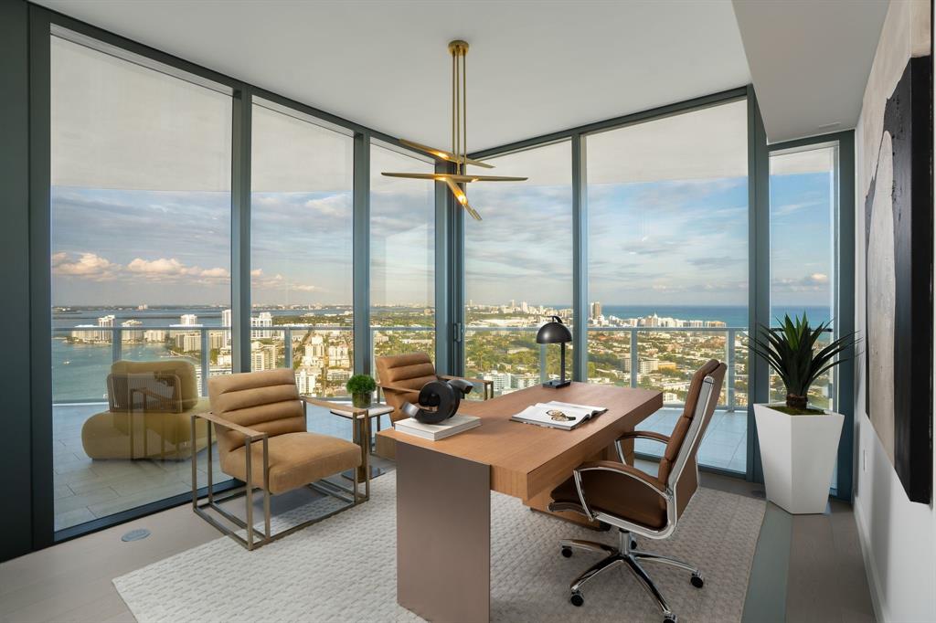 500 Alton Road, Unit 3903 04 Miami Beach, FL 33139 - Photo 30 of 72 a living room with furniture and floor to ceiling windows