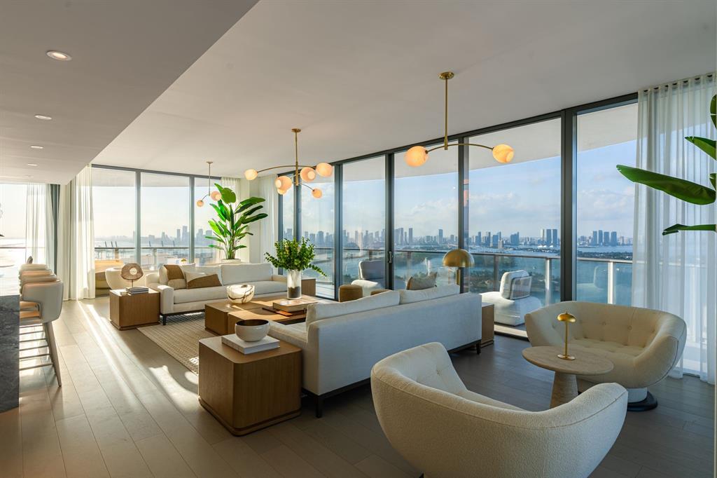 500 Alton Road, Unit 3903 04 Miami Beach, FL 33139 - Photo 3 of 72 a living room with furniture and a large window