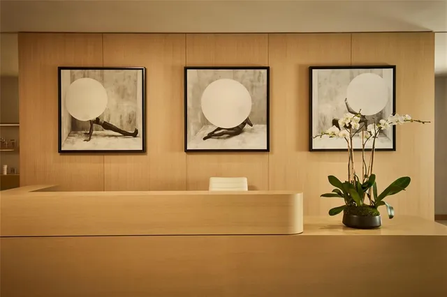 a lobby with furniture and floor to ceiling window